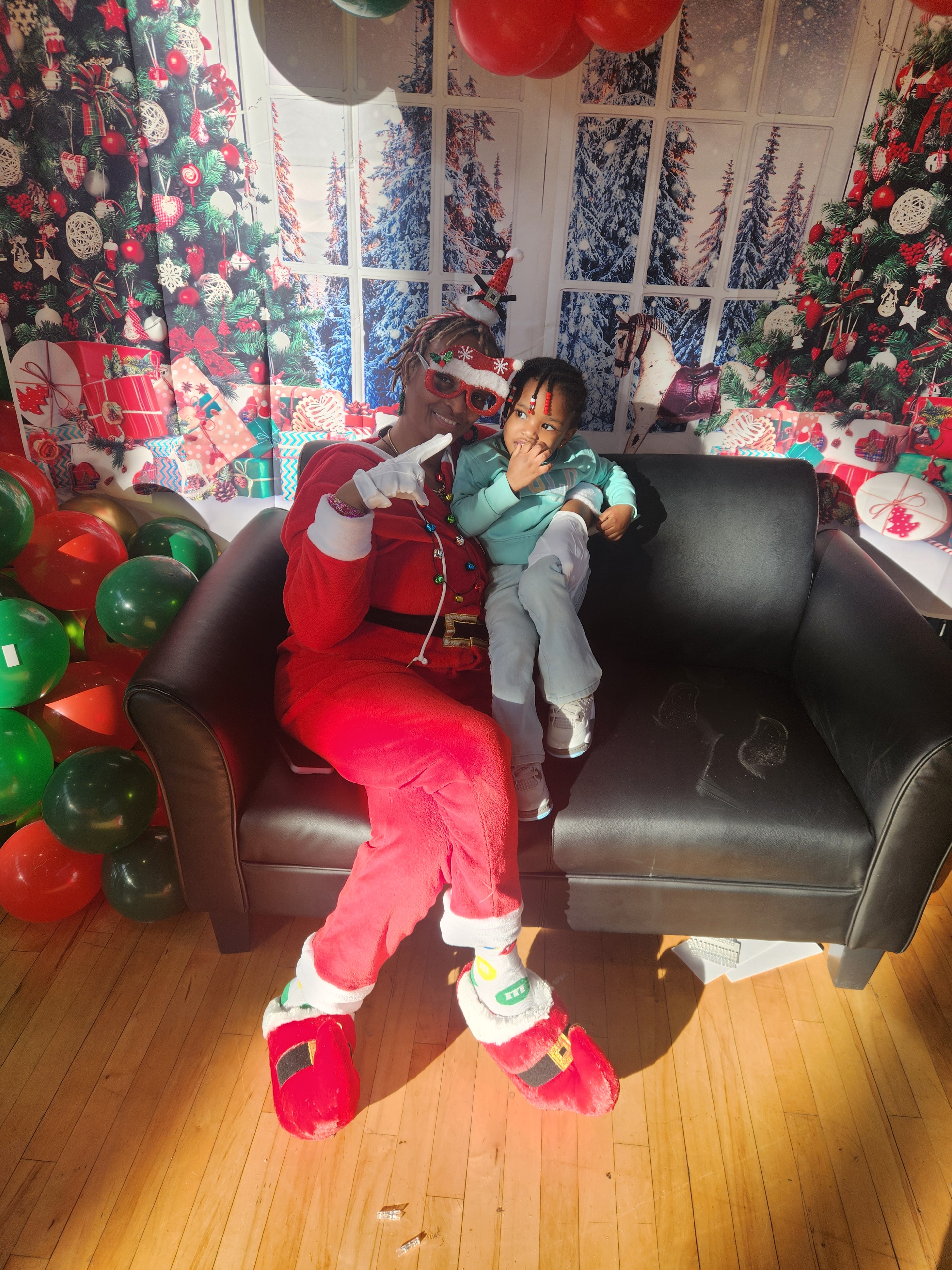 MDLAYAFS Inc. — child with Santa at Holiday Joy event