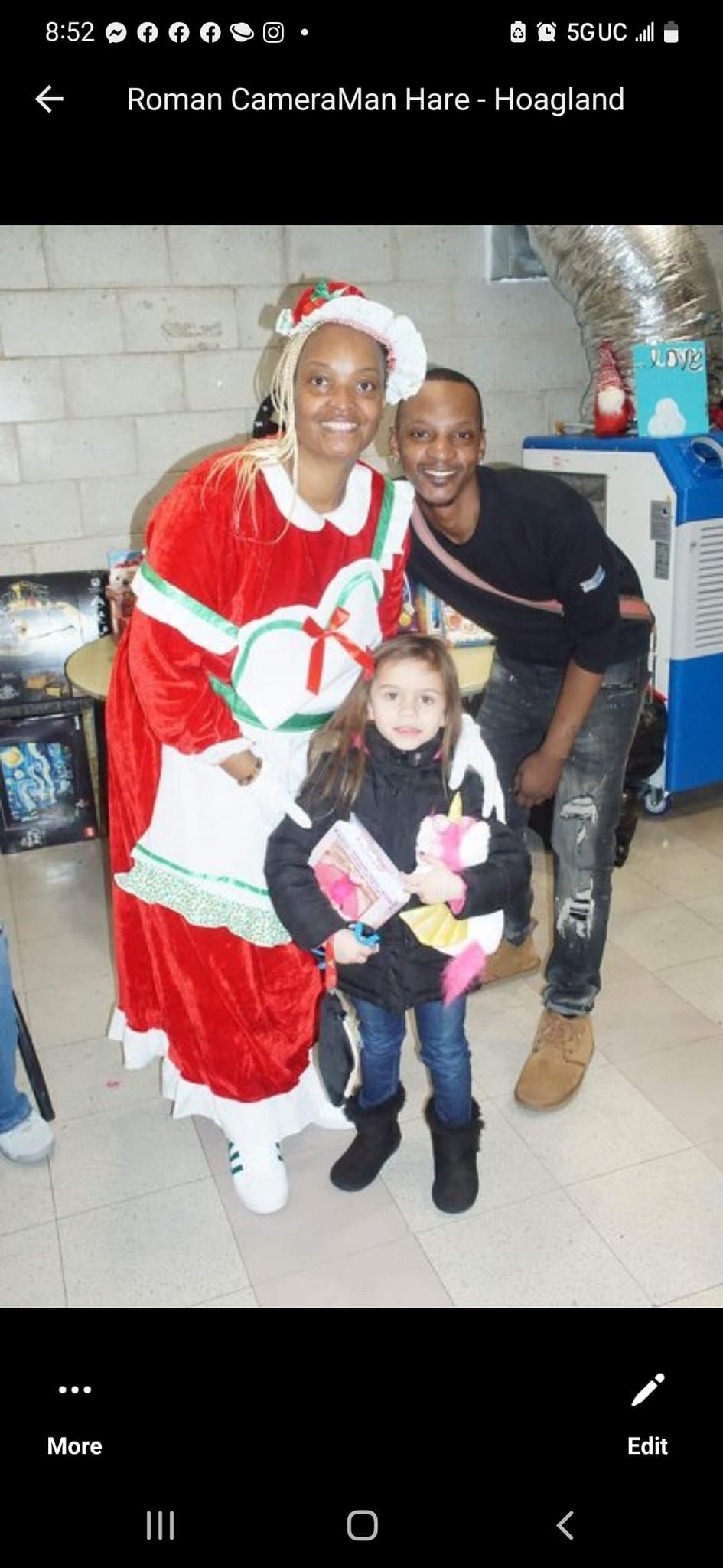 MDLAYAFS Inc. — family with Mrs. Claus at community holiday event