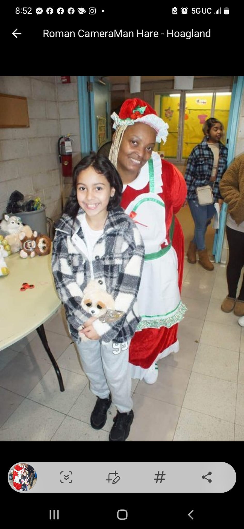 MDLAYAFS Inc. — child receiving holiday gift from Mrs. Claus at Winter Wishes event